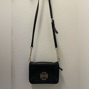Tory Burch cross body small purse. Black with gold logo